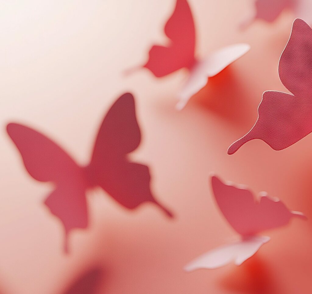 Papillons rouges symbolisant la transformation, l'apaisement émotionnel et la liberté intérieure grâce à l'hypnose thérapeutique et l'EMDR.